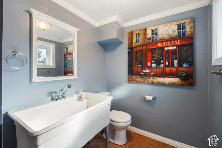 White utility sink with chrome faucet