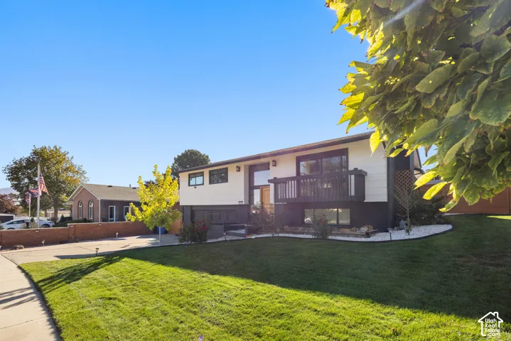 Spacious single-story residence with a modern mixed-material exterior featuring brick and horizontal siding