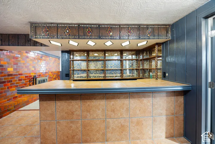 Tile-front bar with a solid surface countertop