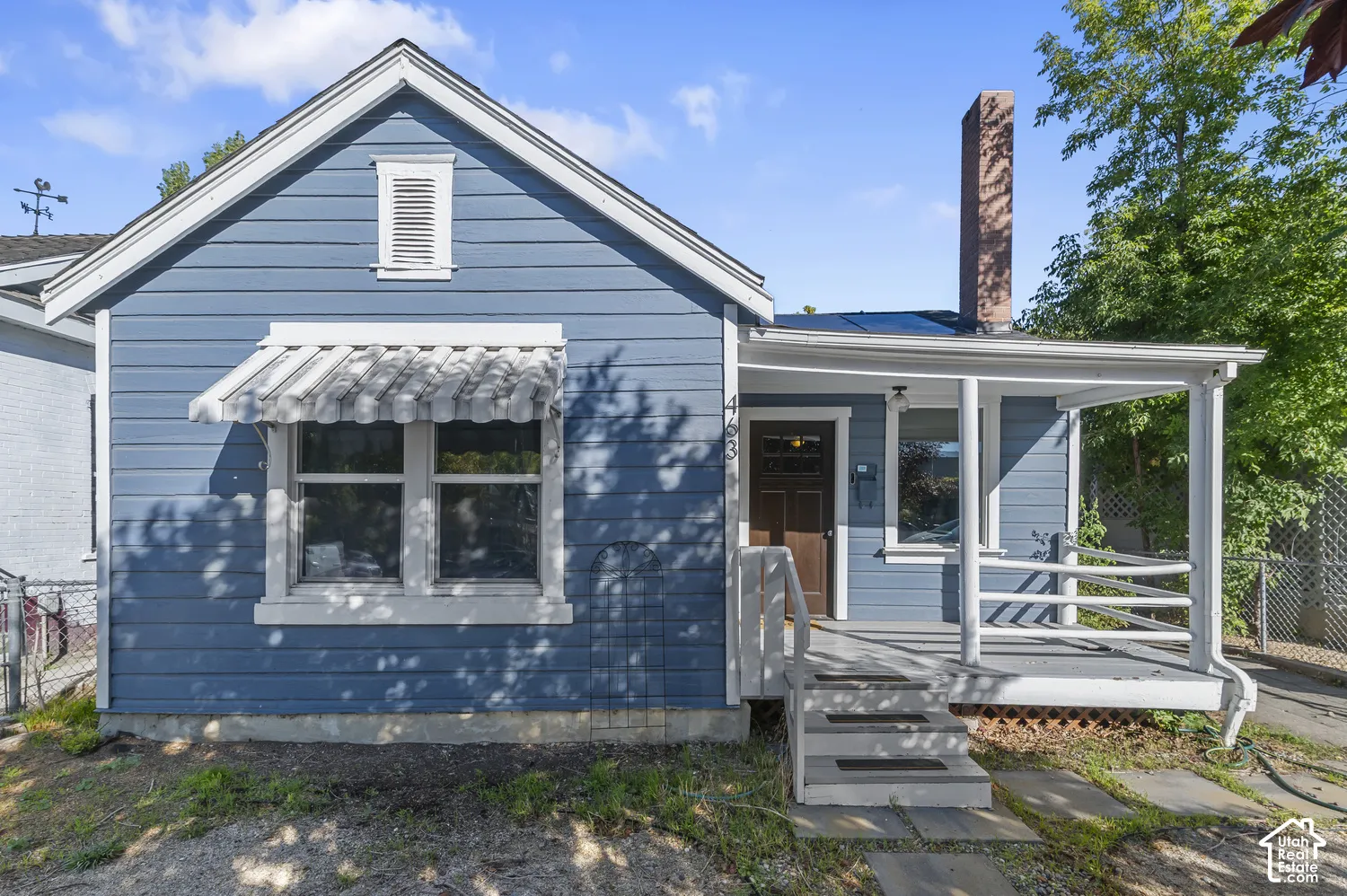 Blue horizontal siding exterior with white trim