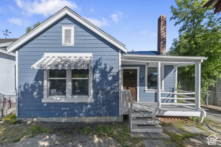 Blue horizontal siding exterior with white trim