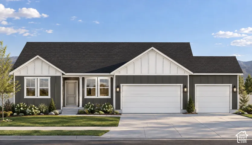 Modern farmhouse exterior with dark siding, white trim, and a two-car garage