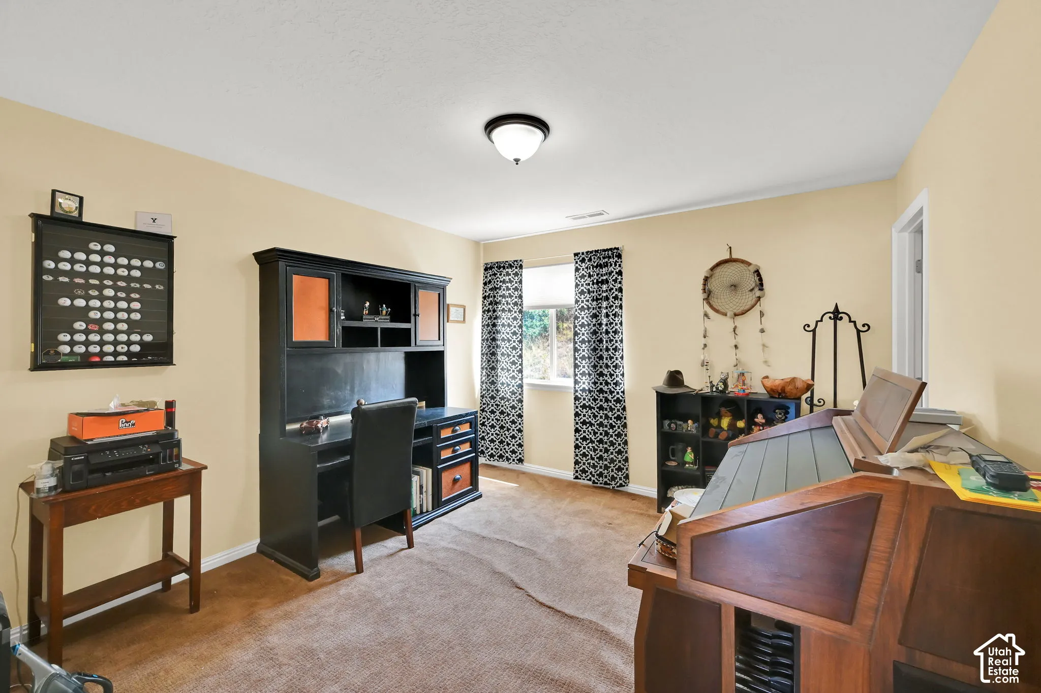 Carpeted flooring with light-toned walls and a flush-mount ceiling fixture