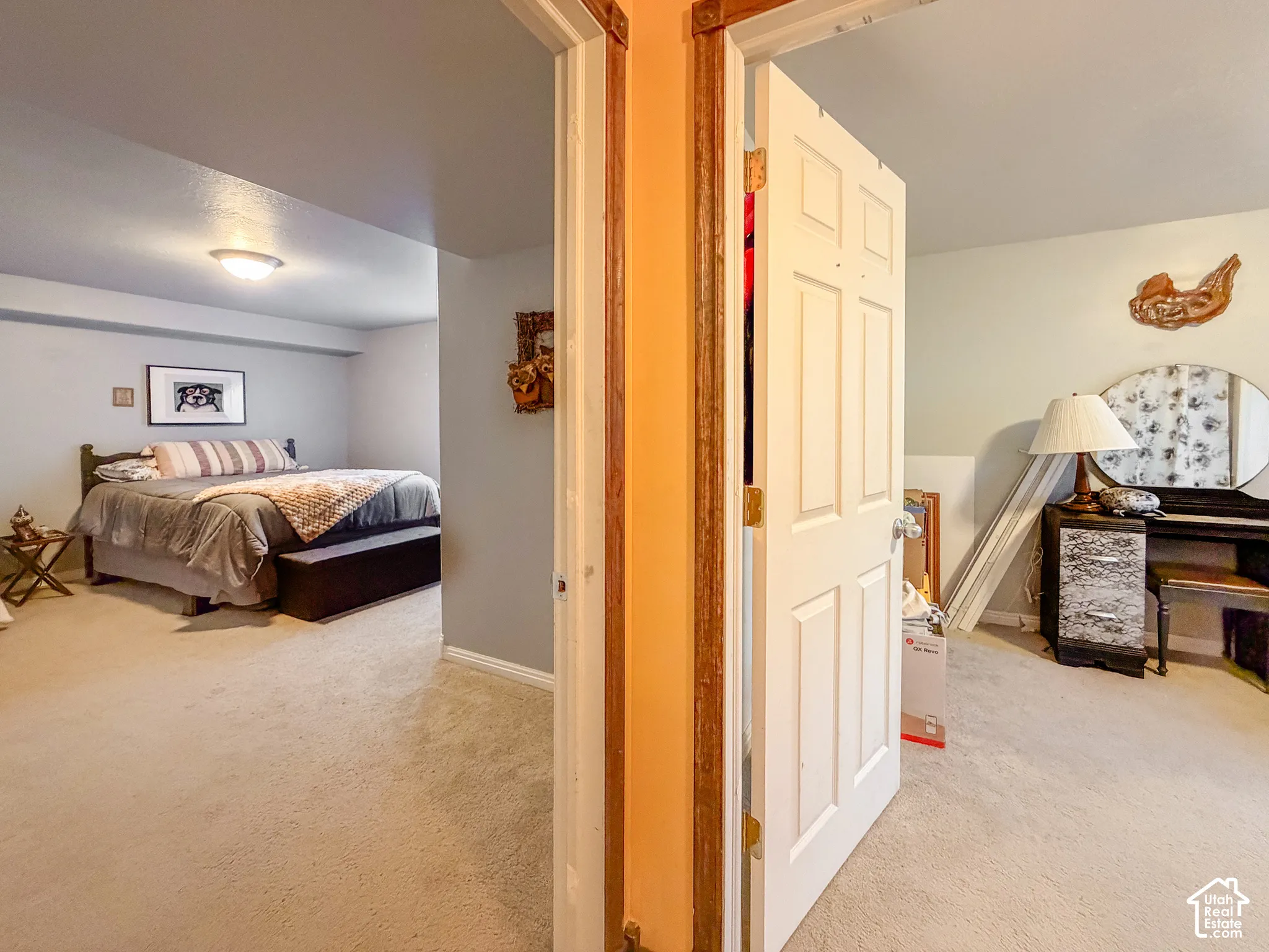 Carpeted flooring throughout, recessed ceiling light fixture, and paneled interior doors