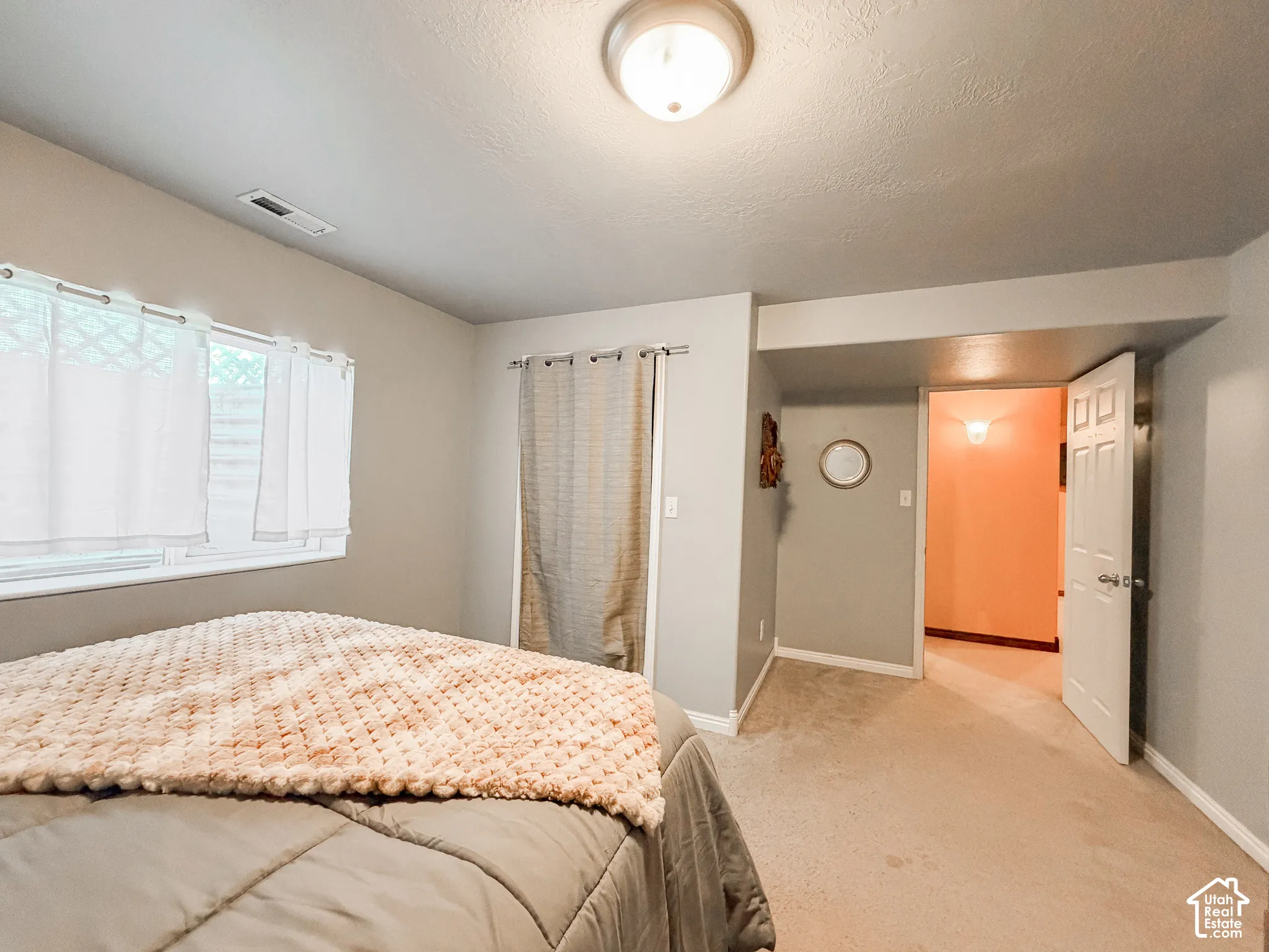 Wall-to-wall carpeting and neutral wall tones