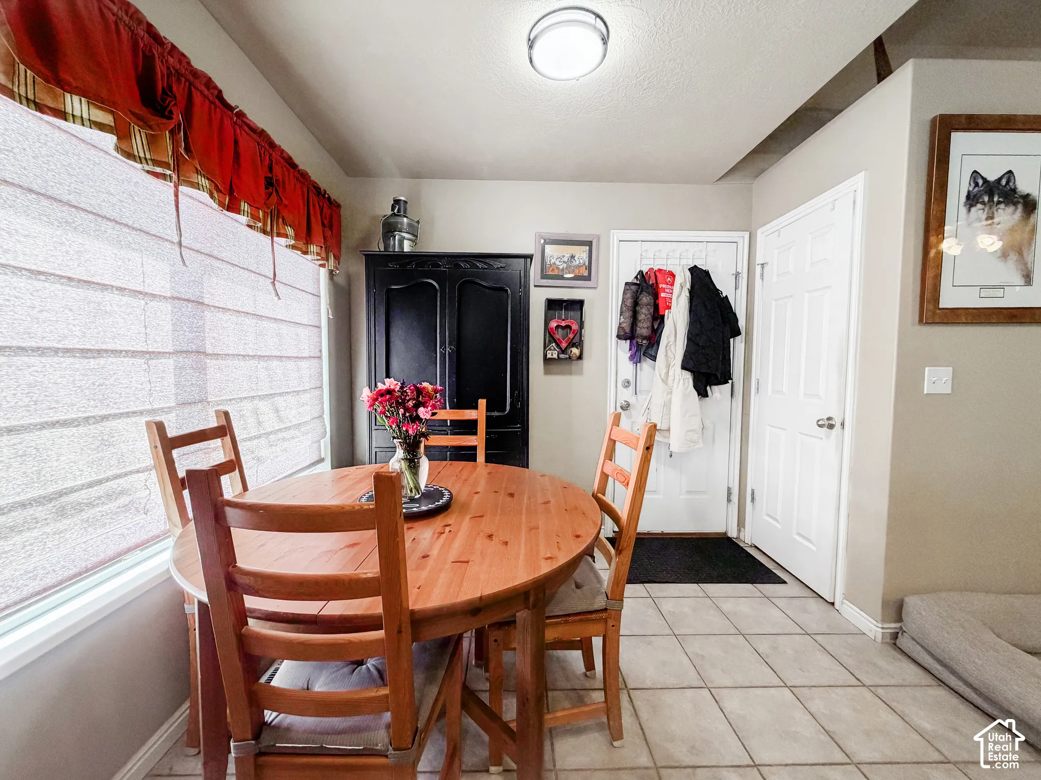 Light-toned tile flooring, light-colored walls, and a built-in recessed ceiling light