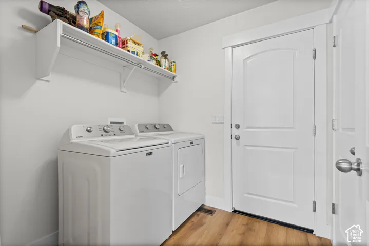 White cabinetry shelving with integrated hanging rod