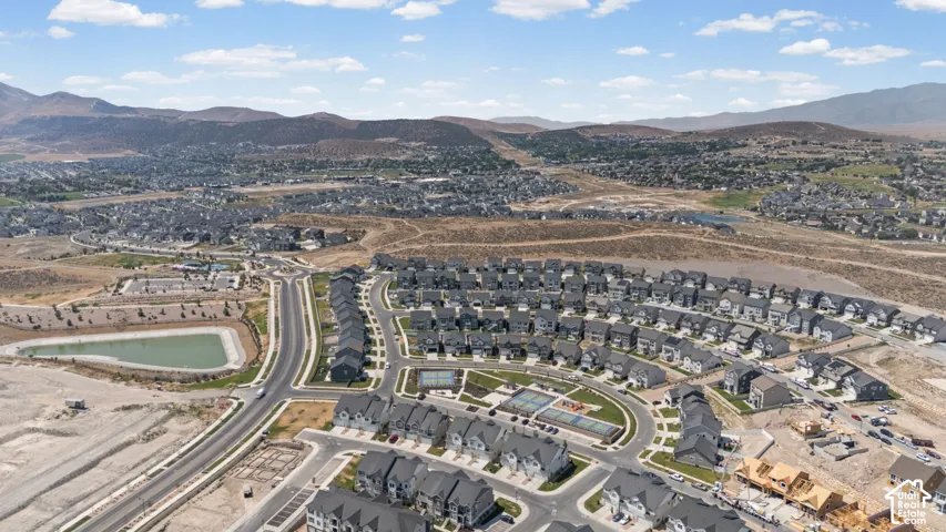Expansive community with varied housing styles, community recreation areas, established infrastructure, and surrounding natural topography