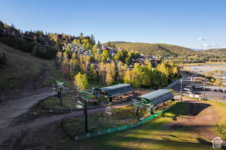 Mountain landscape featuring multiple residential structures and ski lift infrastructure
