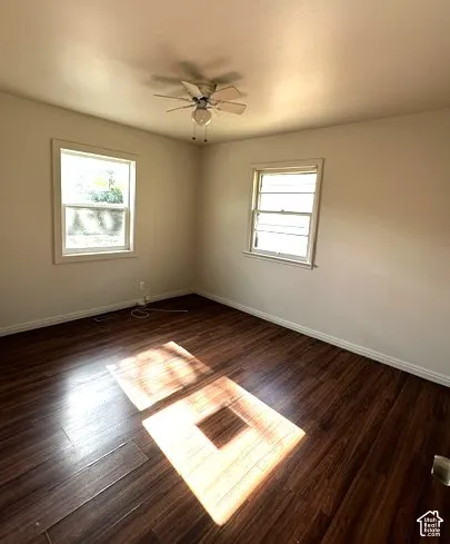 Dark wood-finish flooring with light wall tones