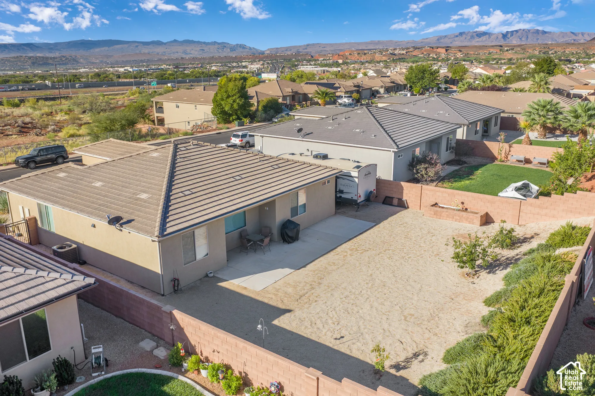 Desert landscaping with established plantings and a durable block wall perimeter