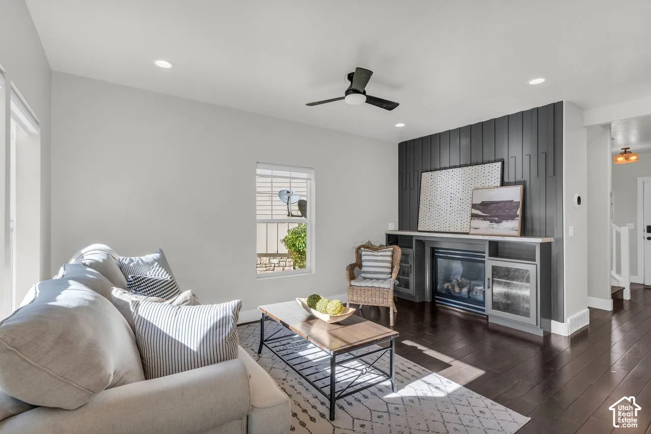 Beautiful updated great room with accent wall, built-ins, and cozy fireplace.