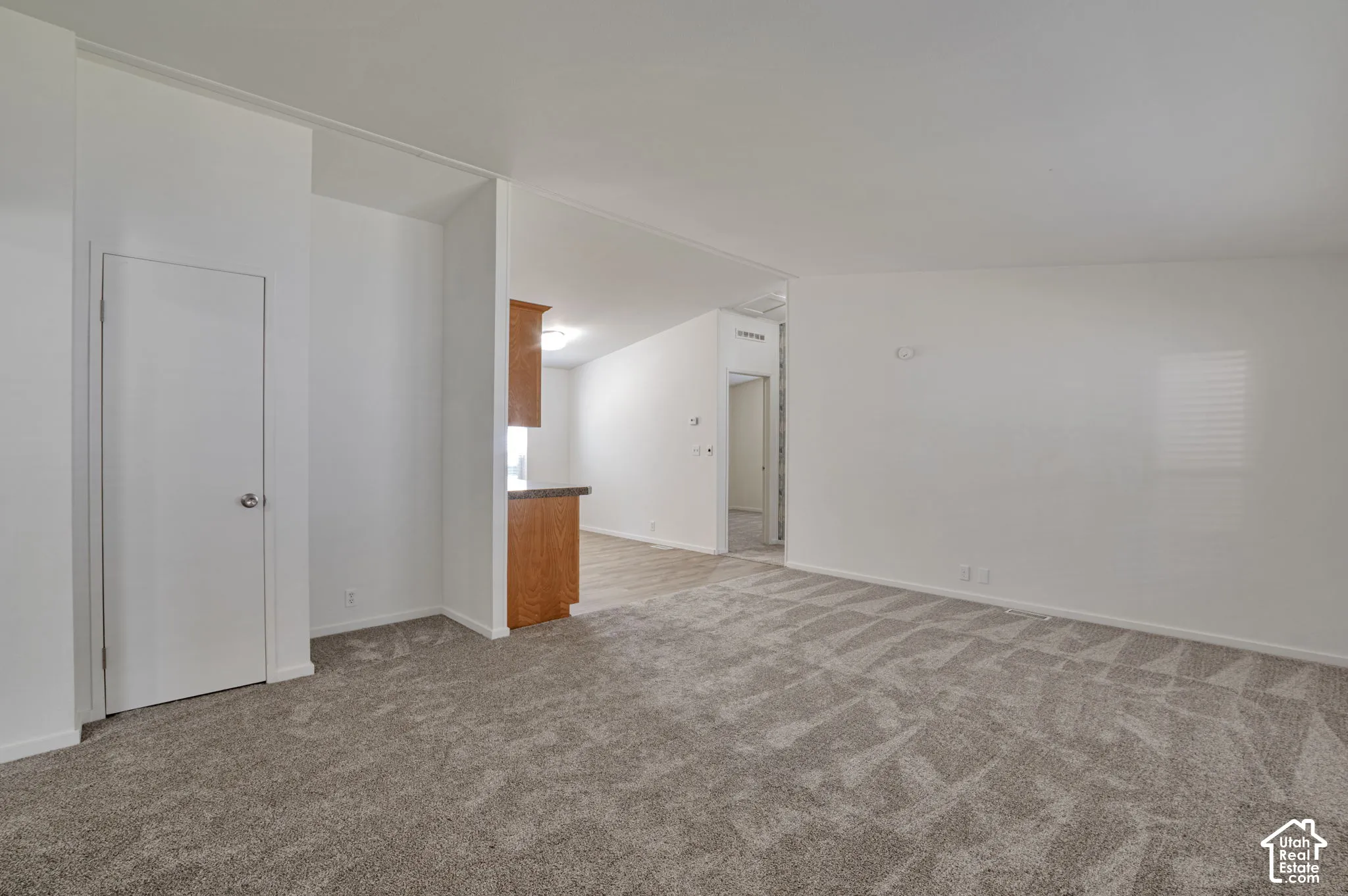 Spacious room with patterned carpeting