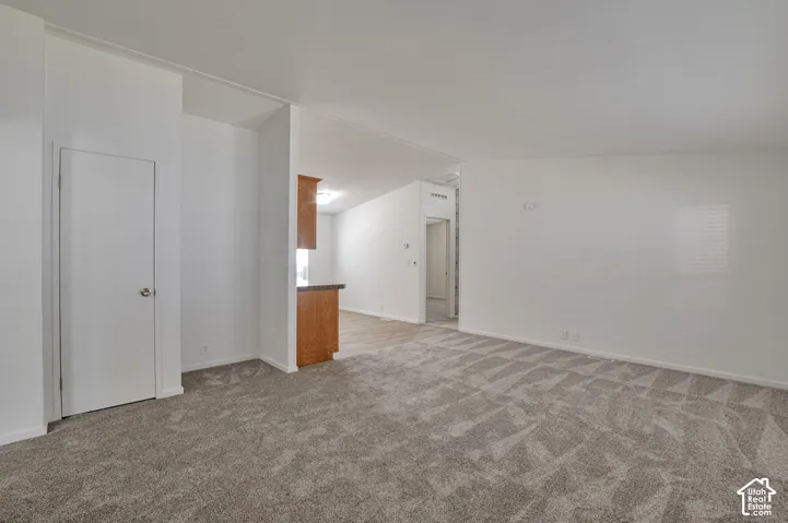 Spacious room with patterned carpeting