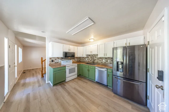 Updated kitchen with laminate flooring.