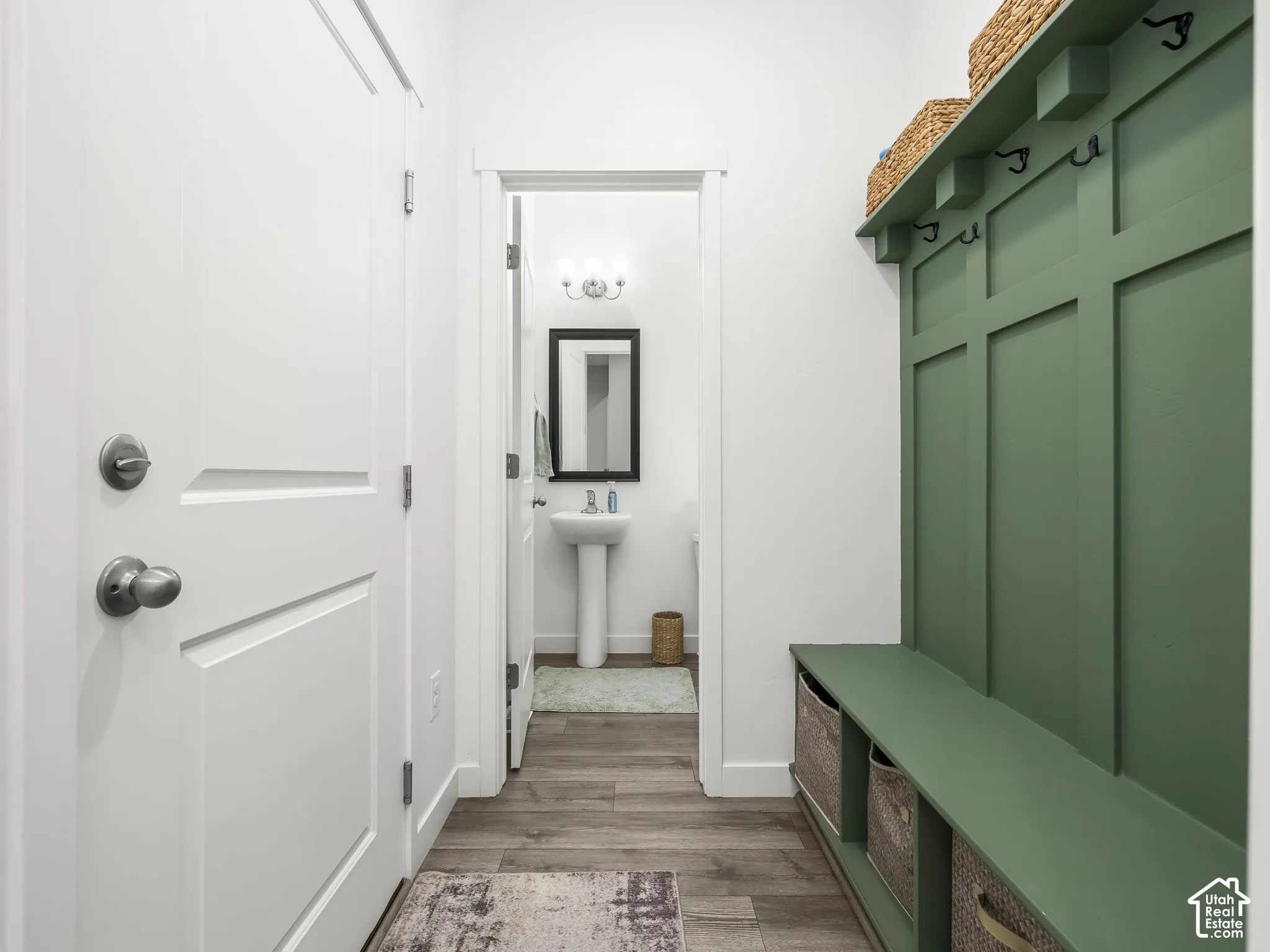 Mudroom featuring a built-in bench, upper shelf, and wall hooks