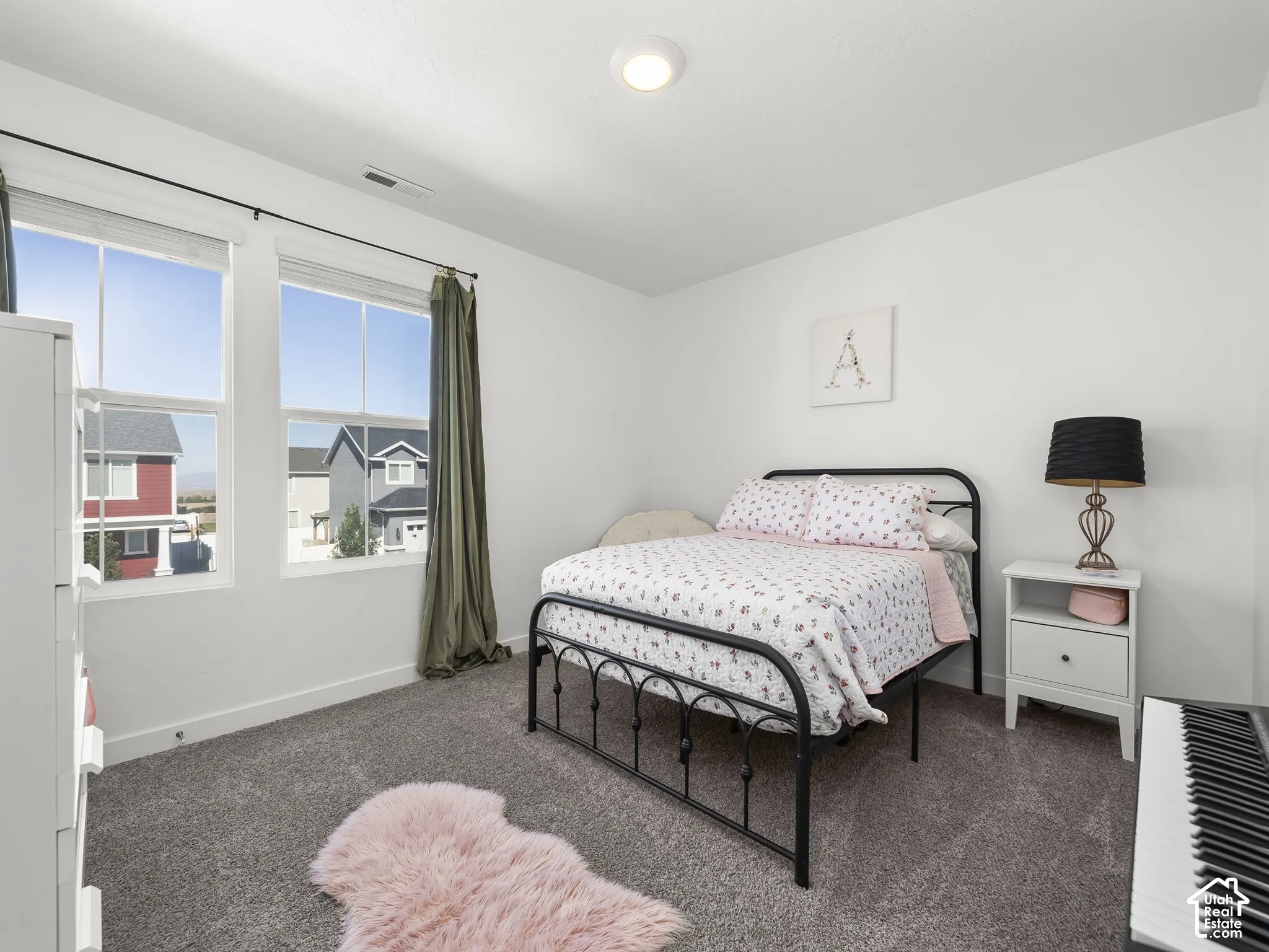 White walls with dark gray carpeting
