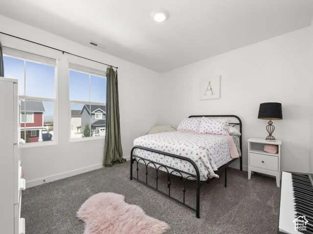 White walls with dark gray carpeting