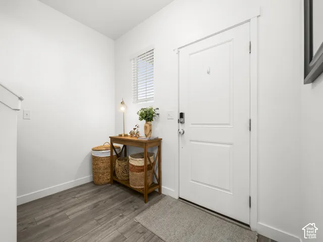 Crisp white interior walls with contrasting wood-finish flooring