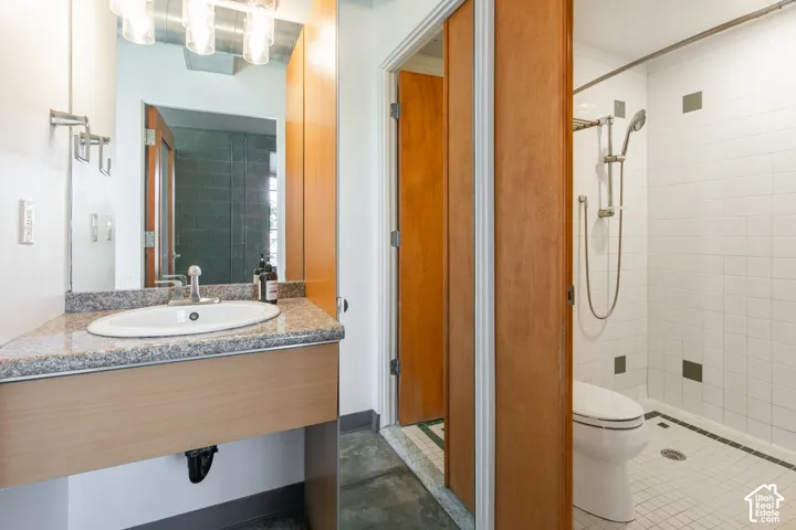 Vanity with granite-style countertop and integrated sink
