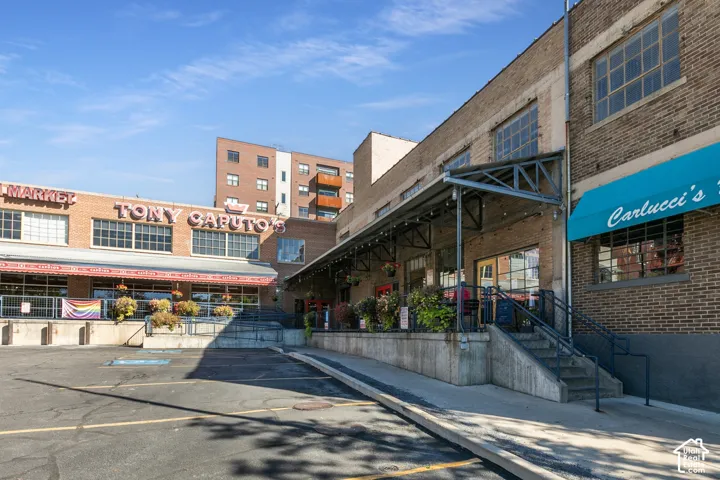 Brick-clad commercial building with prominent signage and large industrial-style windows