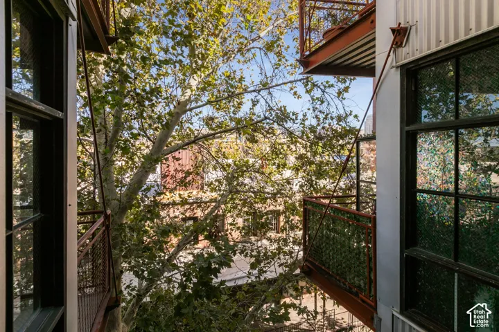 Exterior balconies with metal railing and structural support