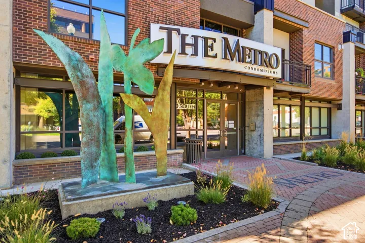 Brick and concrete facade with prominent building signage