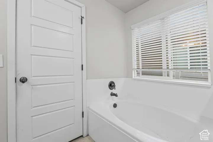 White paneled door with dark hardware