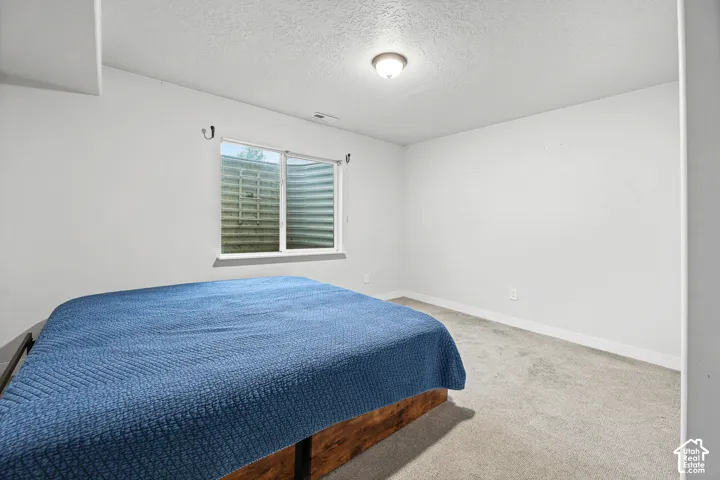 Recessed window with a white frame and a window well