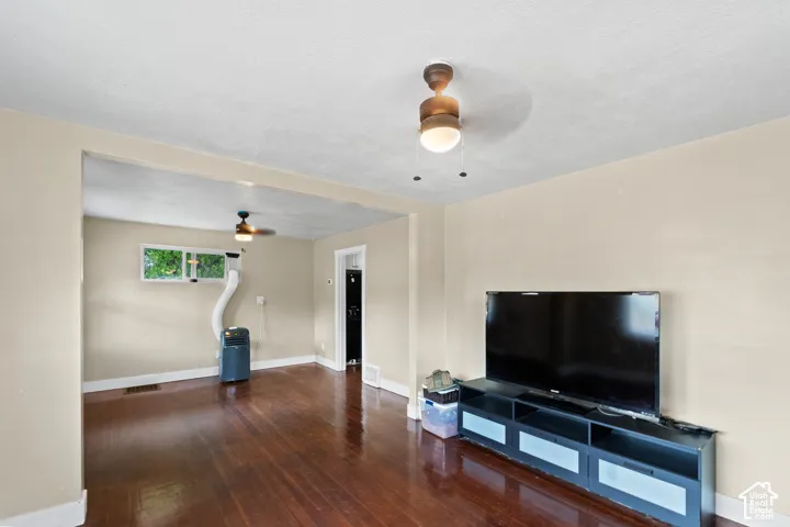 Wood-finish flooring throughout, paired with light neutral wall tones