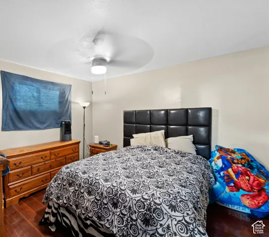 Hardwood flooring with a ceiling fan light fixture