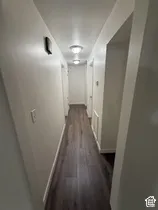 Wood-finish flooring throughout the hallway