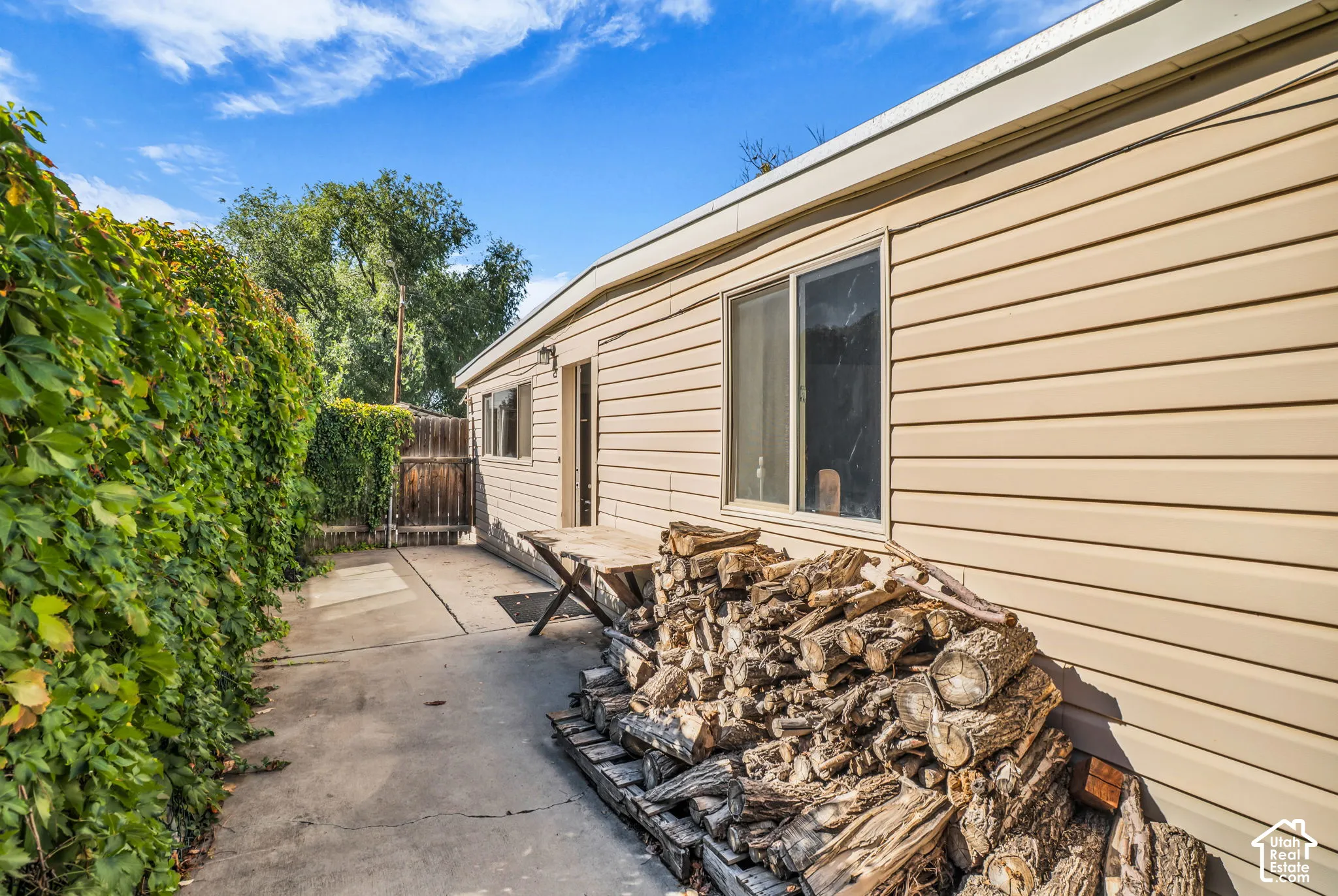 Beige horizontal siding with white trim