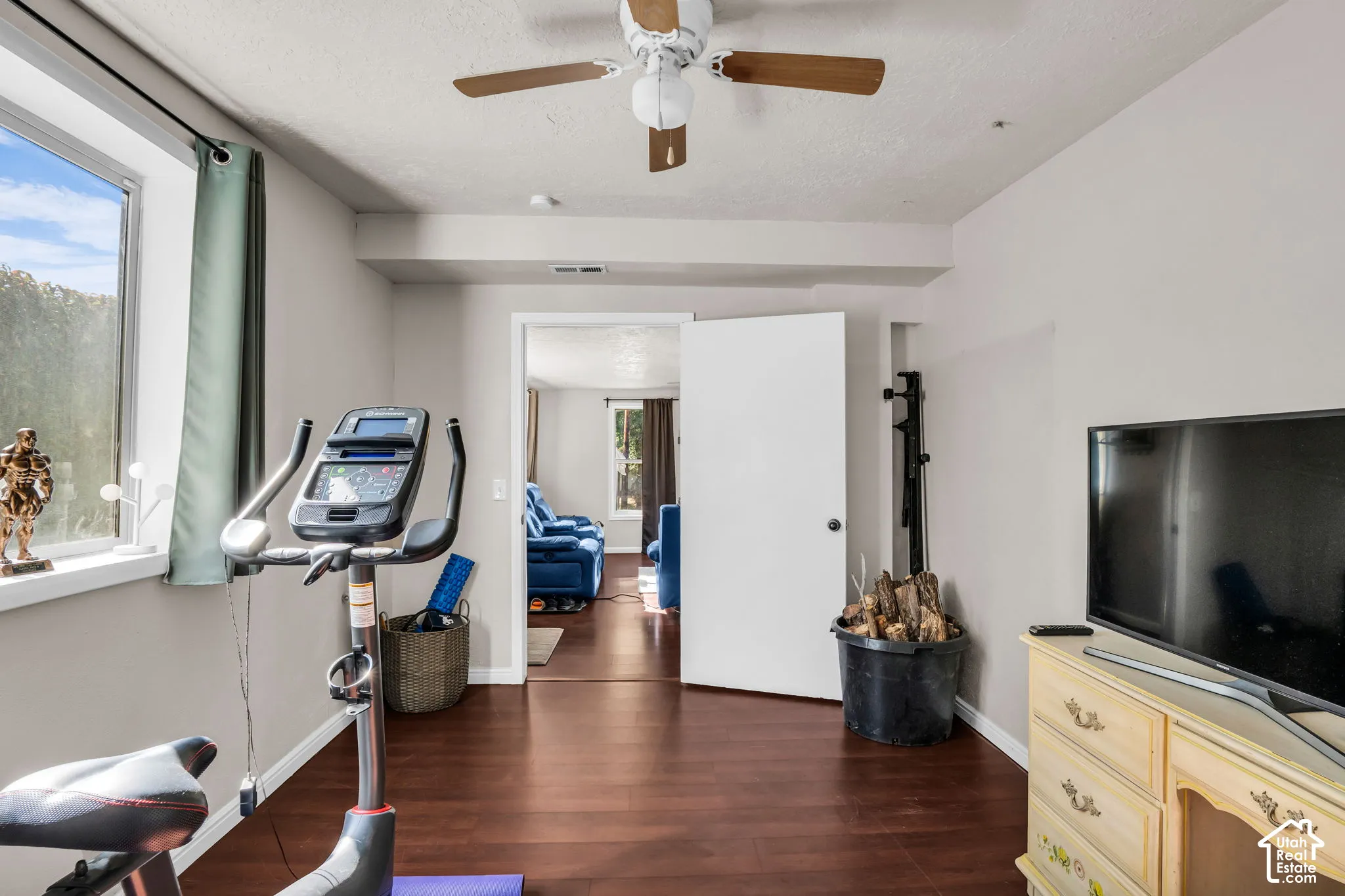 Recessed lighting, wood-finish flooring, and a ceiling fan with light fixture