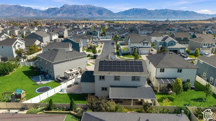 Expansive neighborhood setting with mountain and water backdrops
