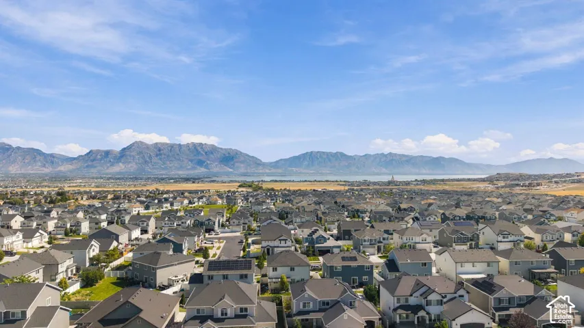 Expansive residential development with mountain backdrops and distant water features