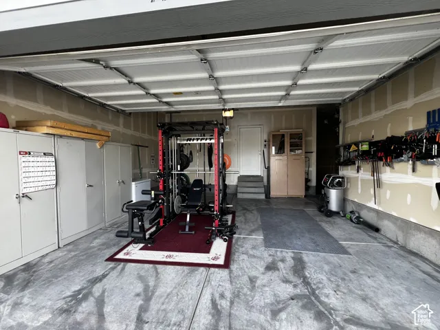 Concrete flooring, interior steps, and built-in wall shelving