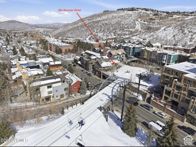 Mountain village setting with ski slope access