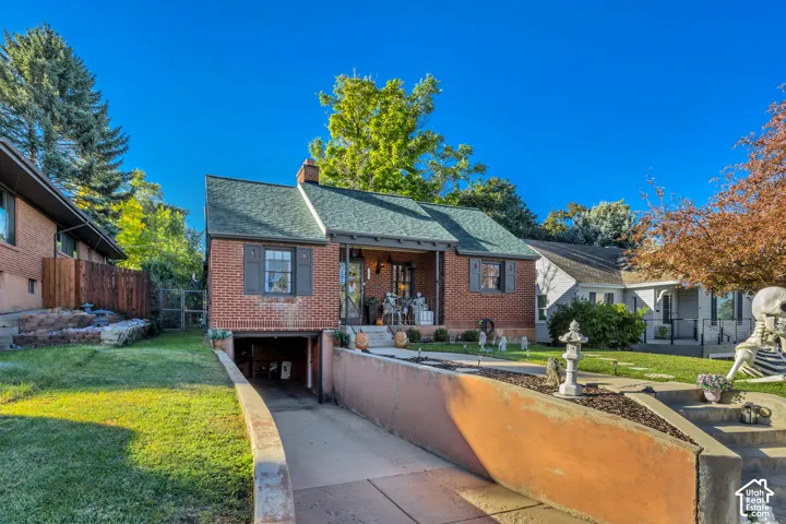 Brick exterior with a gabled roof and gray shutters