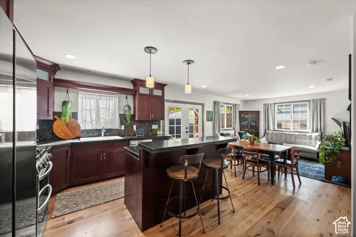 Open-concept living space with wood-finish flooring