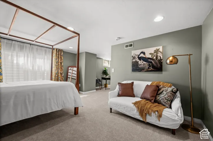 Recessed lighting, wall-to-wall carpeting, and light-filtering window treatments