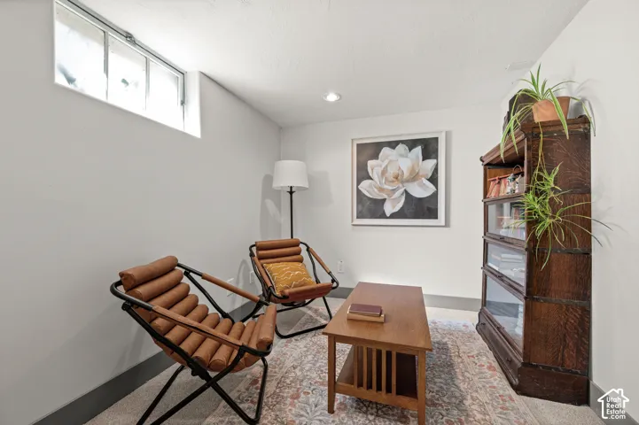 Recessed lighting, light-toned walls, and a transom-style window