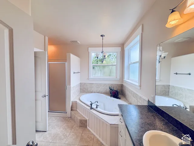 Master Bathroom with separate soaker tub, oversized shower, and huge walk-in closet.