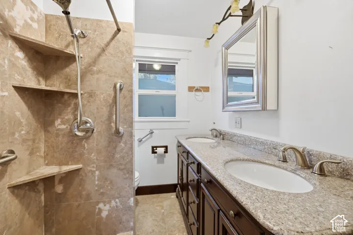Dual vanity with stone countertop and undermount sinks
