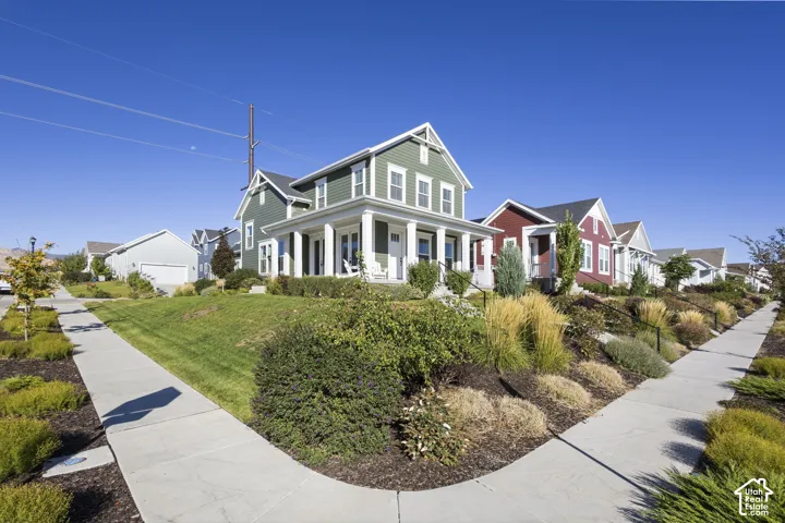 Craftsman-style exterior with a welcoming front porch featuring white columns