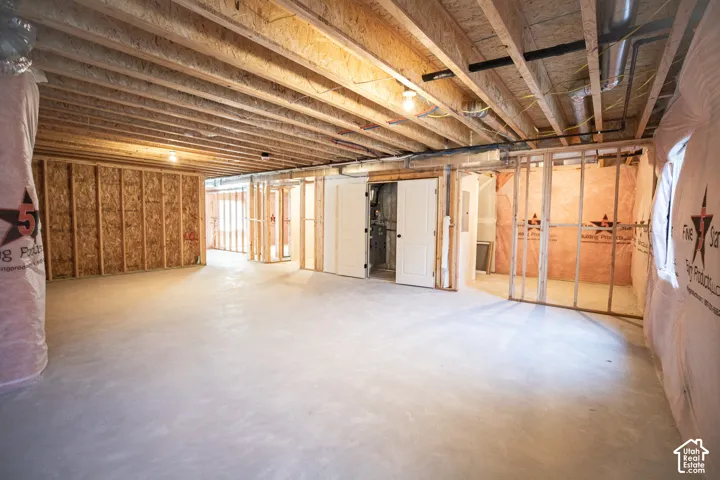 Unfinished basement with potential for large family/game room, full bathroom and three bedrooms.