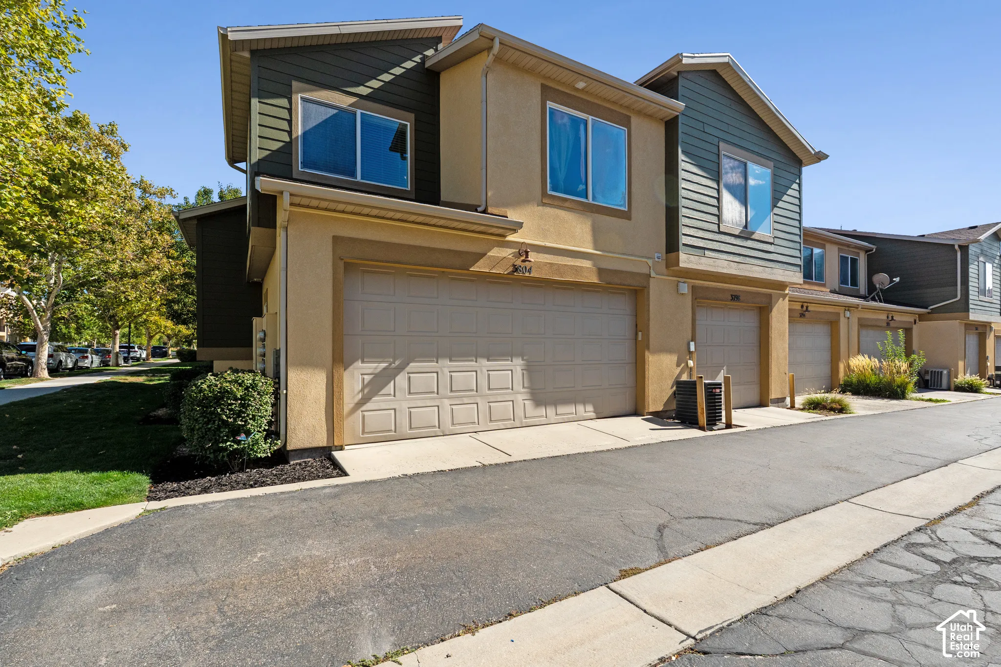 Multi-level exterior featuring stucco and siding finishes