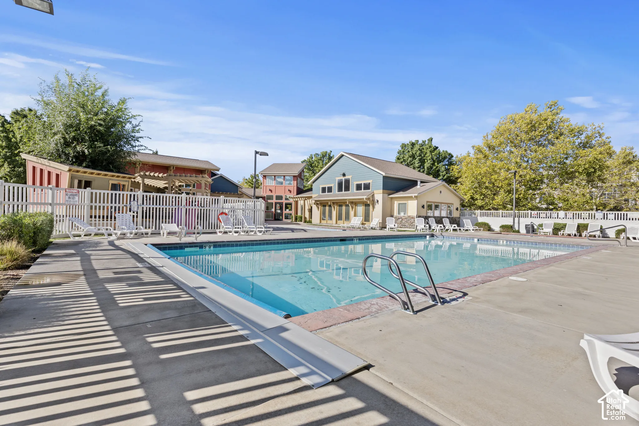 Outdoor swimming pool with concrete decking