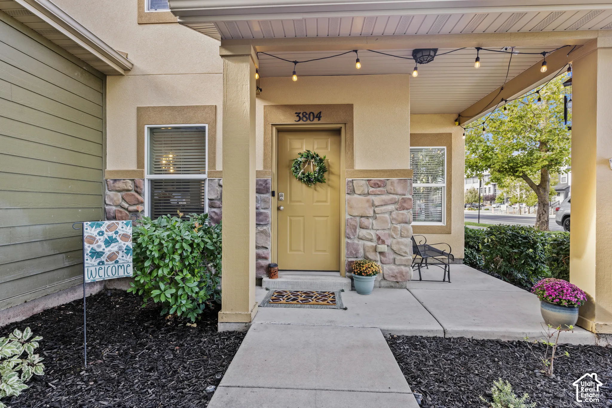 Stucco and stone facade with a covered porch