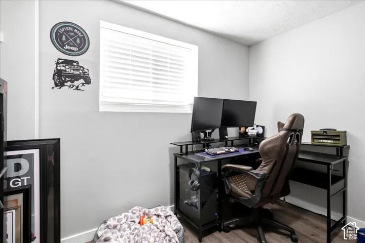 Light gray painted walls with a single window featuring white blinds